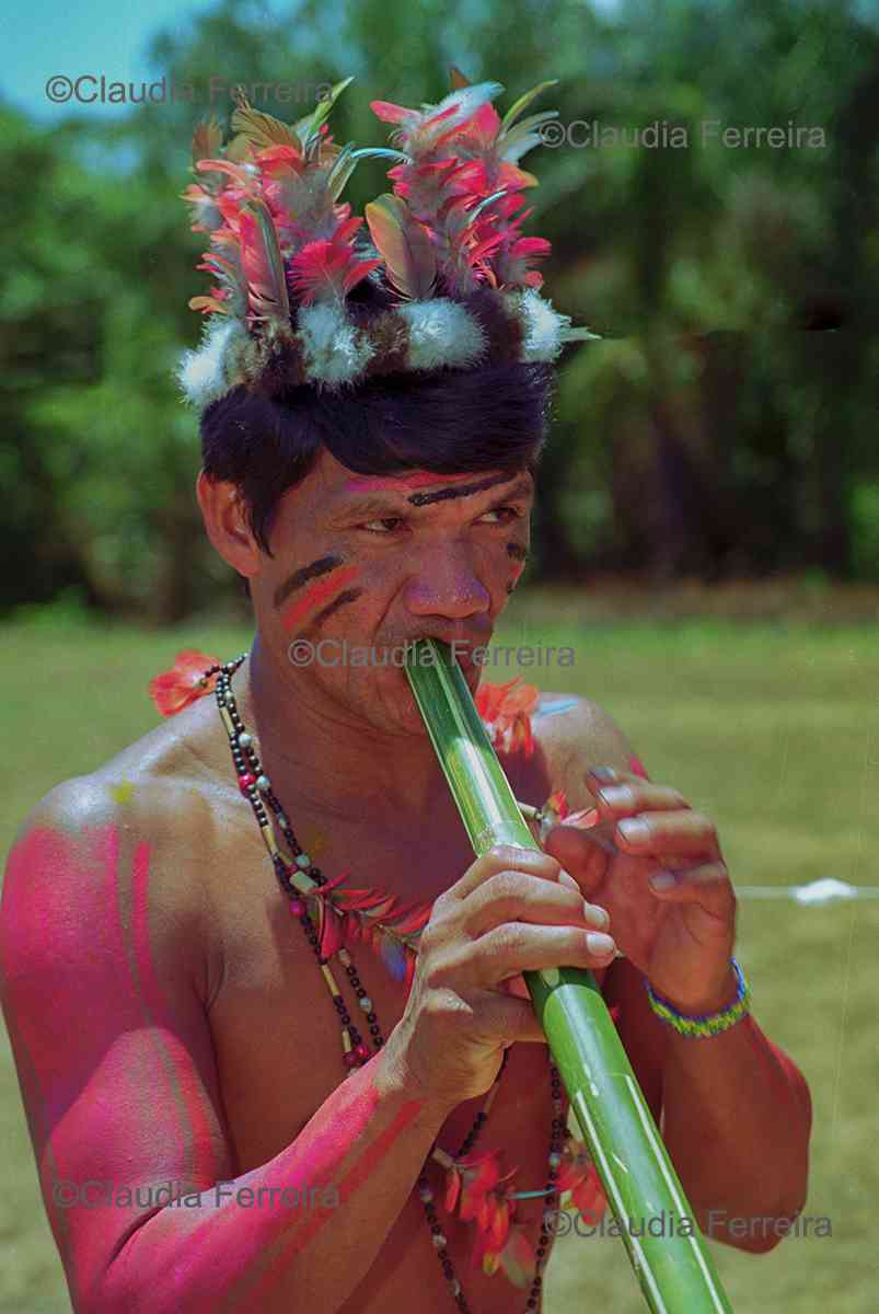 Man Playing A Bamboo Flute