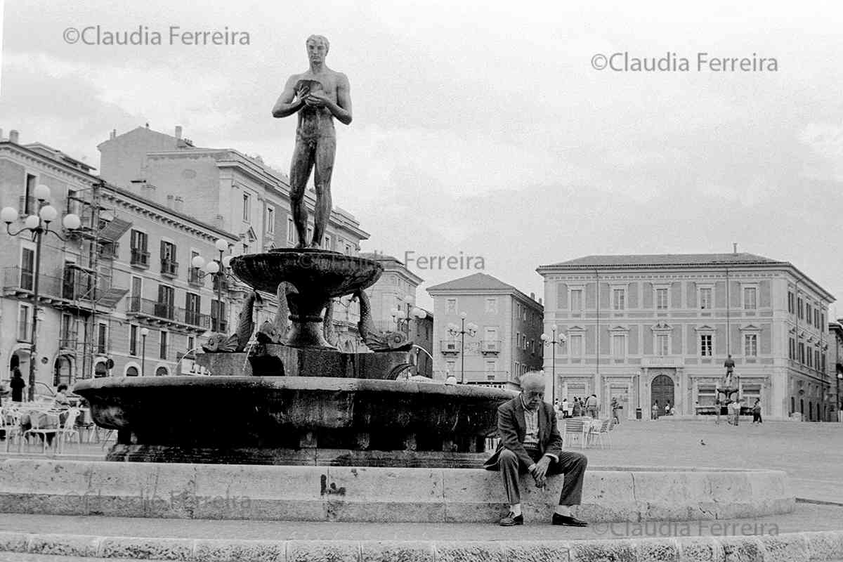 Elderly Man Sitting Next To The Fontana Vecchia